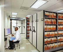 Shelving can be picked up and placed on high density rolling carriages in the future.